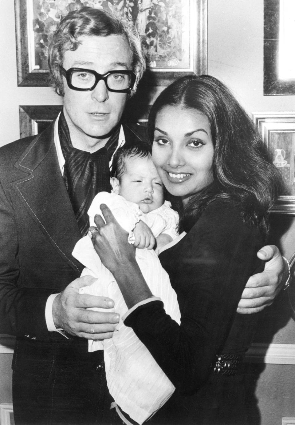 <p>Michael Caine poses with his wife, Shakira, and their newborn daughter, Natasha, at their London home in 1972. </p>