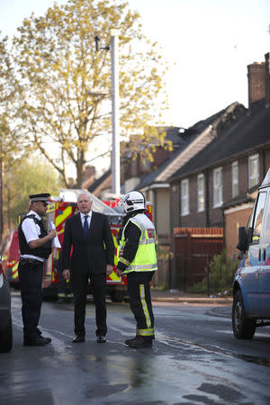 Local Member of Parliament (MP) Iain Duncan Smith talks to the firefighters at the scene of a large fire in a residential care home in Connington Crescent, Chingford, north-east London, Britain, April 20, 2018. REUTERS/Chris Radburn