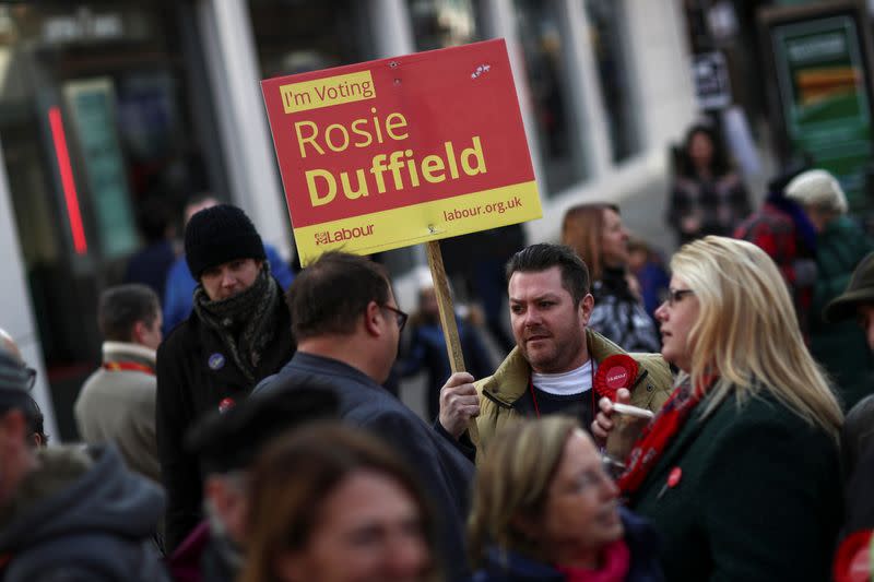 Activist holds a placard in support of Rosie Duffield in Canterbury