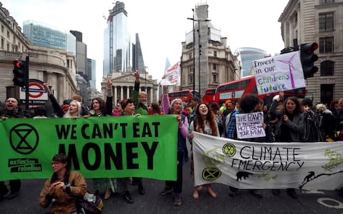 Protesters block traffic at Bank Junction during the Extinction Rebellion protest - Credit: Simon Dawson/Reuters