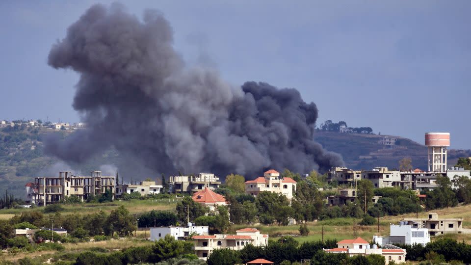 Smoke billows from the site of an Israeli airstrike on the Lebanese village of Jebbain on May 25, 2024, amid ongoing cross-border clashes between Israeli troops and Hezbollah fighters. - Stringer/AFP/Getty Images