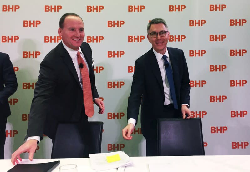 BHP Chairman Ken MacKenzie and Mike Henry are seen at a news conference to announce Henry as BHP's new CEO from January 1, 2020, at BHP's Melbourne headquarters