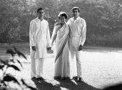 The Indian politician Indira Gandhi stands with her two sons, Rajiv and Sanjay, in the garden of their Delhi home. (Photo by © Hulton-Deutsch Collection/CORBIS/Corbis via Getty Images)