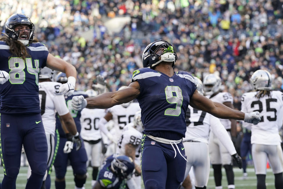 Seattle Seahawks running back Kenneth Walker III is the favorite for NFL Offensive Rookie of the Year.  (AP Photo/Gregory Bull)