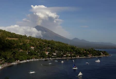 Mount Agung volcano can be seen erupting from Amed in Karangasem Regency, Bali, Indonesia June 29, 2018. REUTERS/Johannes P. Christo