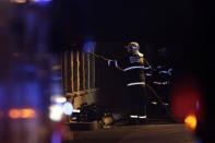 A firefighter works at the site of an explosion in Prague January 1, 2014. REUTERS/David W Cerny