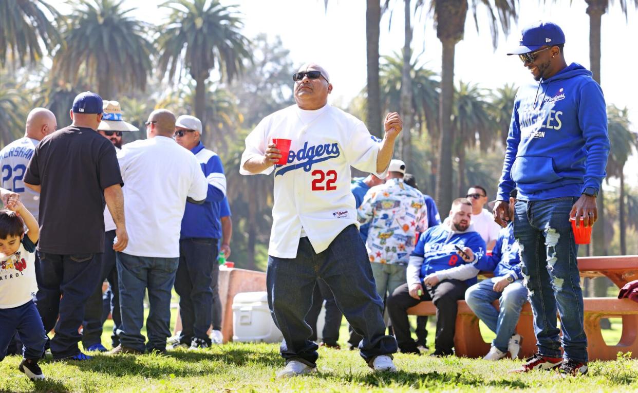 Mark Carrizosa, center, dances to music by a live band.