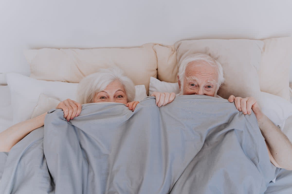 An older couple enjoying some fun in bed (Getty Images)