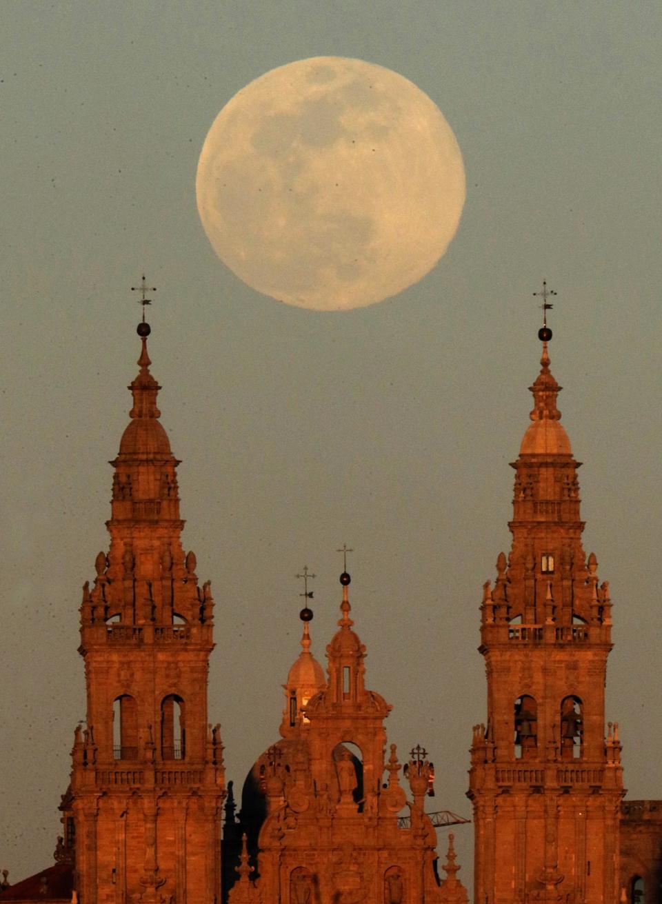 A view of the supermoon over the Santiago de Compostela cathedral in Galicia, Spain (EPA)