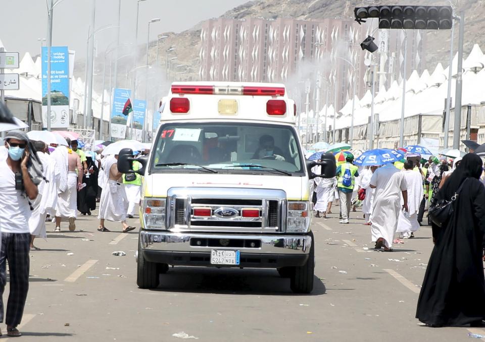 An ambulance evacuates victims following a crush caused by large numbers of people pushing at Mina, outside the Muslim holy city of Mecca