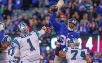 Dec 20, 2015; East Rutherford, NJ, USA; New York Giants defensive end Jason Pierre-Paul (90) blocks Carolina Panthers quarterback Cam Newton (1) pass during the fourth quarter at MetLife Stadium. Mandatory Credit: Jim O'Connor-USA TODAY Sports