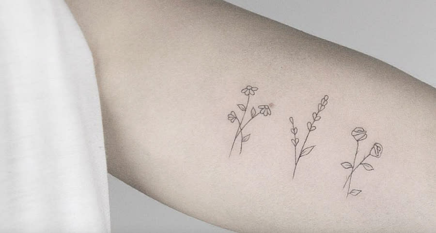 These strangely delicate tiny floral tattoos have the cleanest lines we’ve ever seen