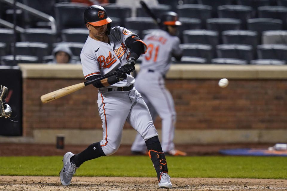 Baltimore Orioles' Ramon Urias hits a single during the ninth inning of the team's baseball game against the New York Mets on Tuesday, May 11, 2021, in New York. (AP Photo/Frank Franklin II)