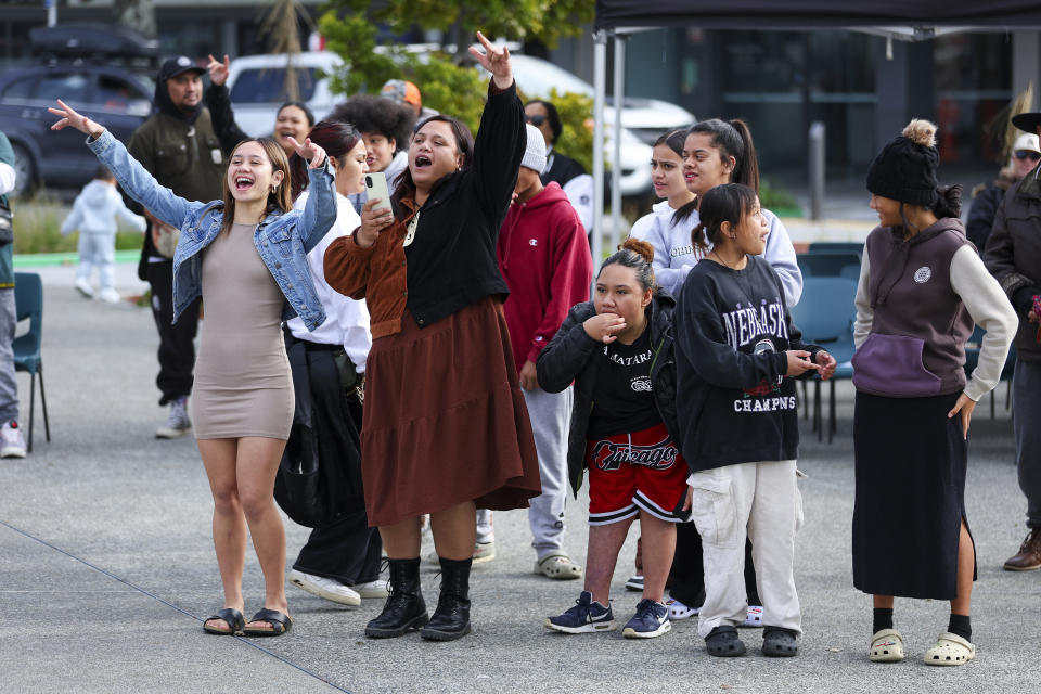 People listen to music during Matariki Whanau Day at the Wainuiomata Community Hub in Wellington, New Zealand on June 22, 2024. Now in its third year as a nationwide public holiday in New Zealand, Matariki marks the lunar new year by the rise of the star cluster known in the Northern Hemisphere as the Pleiades. (AP Photo/Hagen Hopkins)