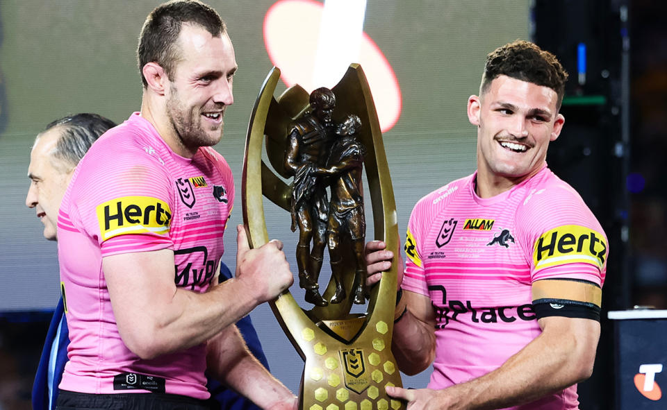 Isaah Yeo and Nathan Cleary with the NRL premiership trophy.