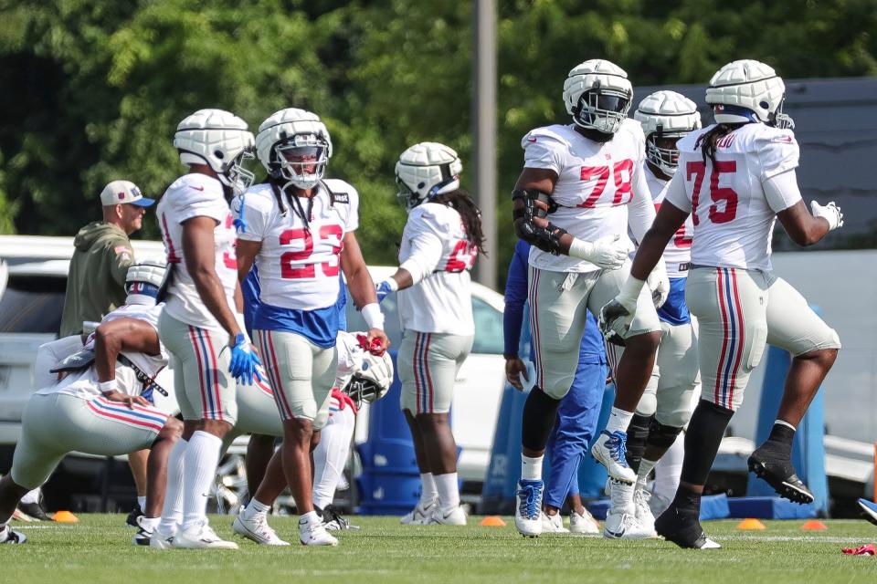 New York Giants players warm up during a joint practice at Detroit Lions headquarters and training facility in Allen Park on Tuesday, August 8, 2023.