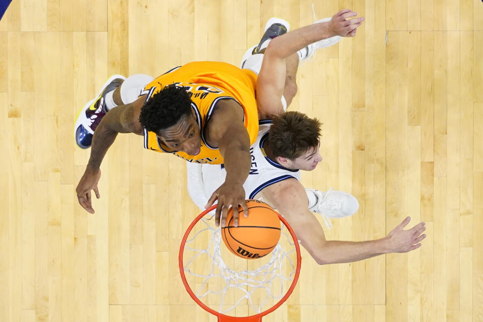 Drexel's Amari Williams, top, goes up for a shot over Villanova's Brendan Hausen during the first half of an NCAA college basketball game, Saturday, Dec. 2, 2023, in Philadelphia. (AP Photo/Matt Rourke)