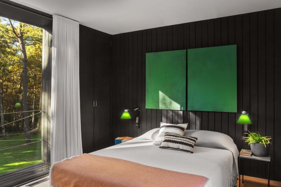 <p>Large blocks of complementary color make an eye-catching statement in this black and white bedroom designed by <a href="https://www.chairish.com/shop/2michaels-design" rel="nofollow noopener" target="_blank" data-ylk="slk:2Michaels Design;elm:context_link;itc:0;sec:content-canvas" class="link ">2Michaels Design</a>. </p>