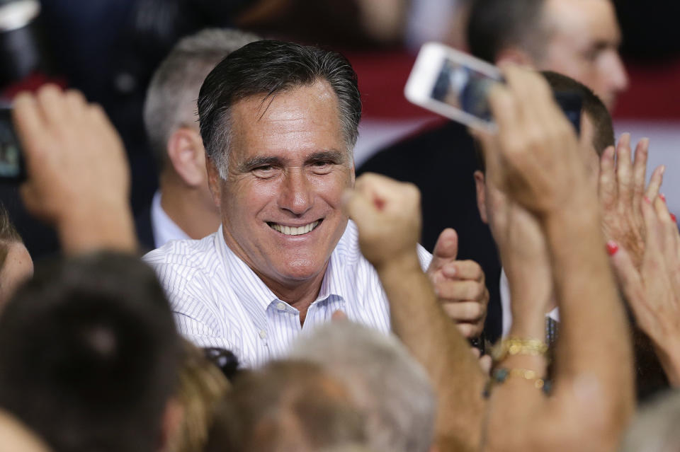 Republican presidential candidate, former Massachusetts Gov. Mitt Romney greets supporters after speaking at a rally Friday, Sept. 21, 2012, in Las Vegas. Romney campaigned in Nevada as aides released a 2011 federal income tax return showing he and his wife, Ann, paid $1.94 million in federal taxes last year on income of $13.7 million. (AP Photo/Julie Jacobson)