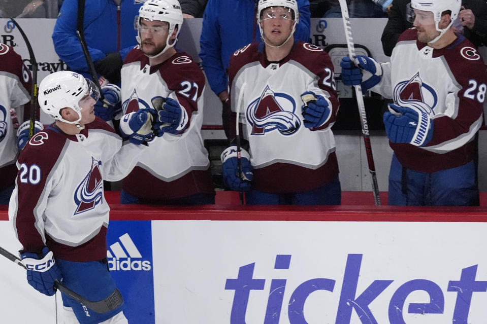 Colorado Avalanche center Ross Colton (20) celebrates with teammates after scoring during the second period of an NHL hockey game against the Chicago Blackhawks in Chicago, Thursday, Feb. 29, 2024. (AP Photo/Nam Y. Huh)