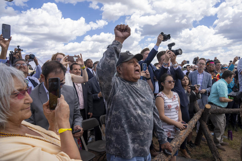 Supporters photograph as President Joe Biden signs a proclamation designating the Baaj Nwaavjo I'Tah Kukveni National Monument at the Red Butte Airfield Tuesday, Aug. 8, 2023, in Tusayan, Ariz. (AP Photo/Alex Brandon)