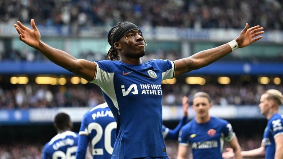 Noni Madueke celebrates scoring for Chelsea.