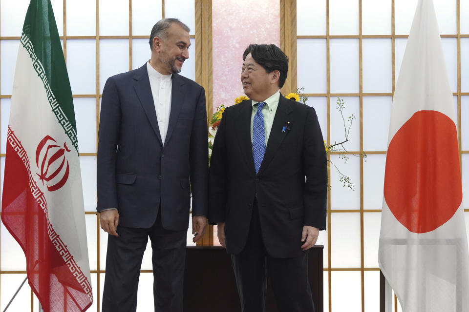 Japanese Foreign Minister Yoshimasa Hayashi, right, and Iranian counterpart Hossein Amir-Abdollahian pose for media before their meeting Monday, Aug. 7, 2023, in Tokyo. (AP Photo/Eugene Hoshiko)