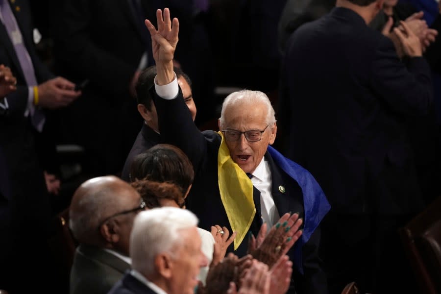 Rep. Bill Pascrell (D-N.J.) holds up four fingers for ‘four more years’ as President Biden delivers the State of the Union address. (AP Photo/Andrew Harnik)