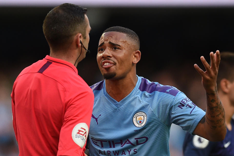 Manchester City's Brazilian striker Gabriel Jesus (R) remonstrates with English referee Michael Oliver after his goal was dissallowed following a VAR decision during the English Premier League football match between Manchester City and Tottenham Hotspur at the Etihad Stadium in Manchester, north west England, on August 17, 2019. - The match ended in a draw at 2-2. (Photo by Oli SCARFF / AFP) / RESTRICTED TO EDITORIAL USE. No use with unauthorized audio, video, data, fixture lists, club/league logos or 'live' services. Online in-match use limited to 120 images. An additional 40 images may be used in extra time. No video emulation. Social media in-match use limited to 120 images. An additional 40 images may be used in extra time. No use in betting publications, games or single club/league/player publications. /         (Photo credit should read OLI SCARFF/AFP/Getty Images)