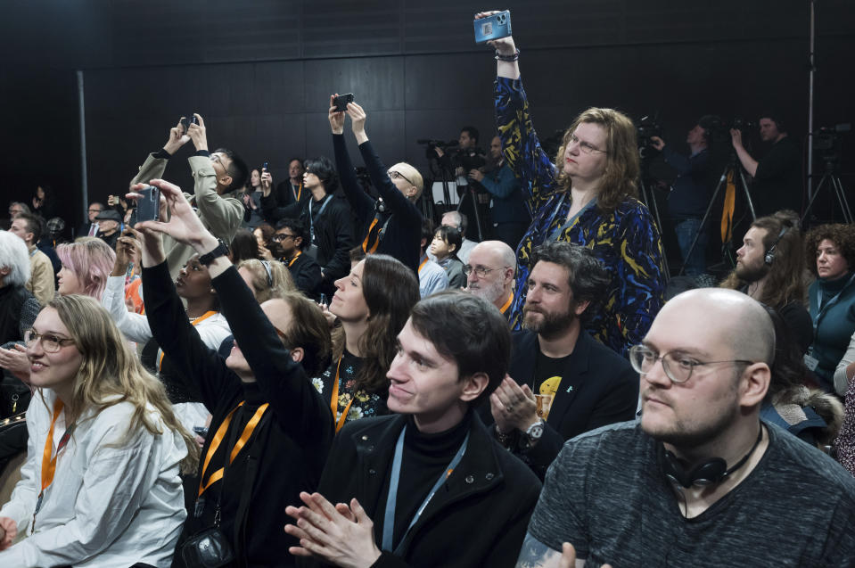 Journalists cover the news conference of the International Jury at the opening day of International Film Festival, Berlinale, in Berlin, Thursday, Feb. 15, 2024. The 74th edition of the festival will run until Sunday, Feb. 25, 2024 at the German capital. (AP Photo/Markus Schreiber)