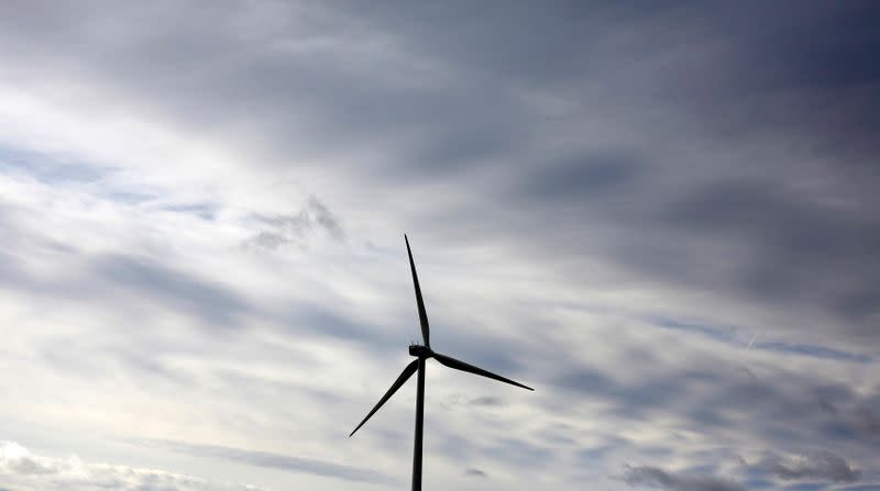 An Iberdrola's power generating wind turbine is seen against cloudy sky at Moranchon wind farm