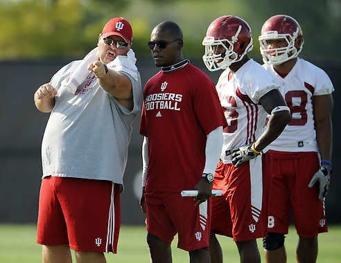 Hoosiers co-offensive coordinator and quarterbacks Rod Smith (left) talks with running backs coach Deland McCullough during an Aug. 9 practice.