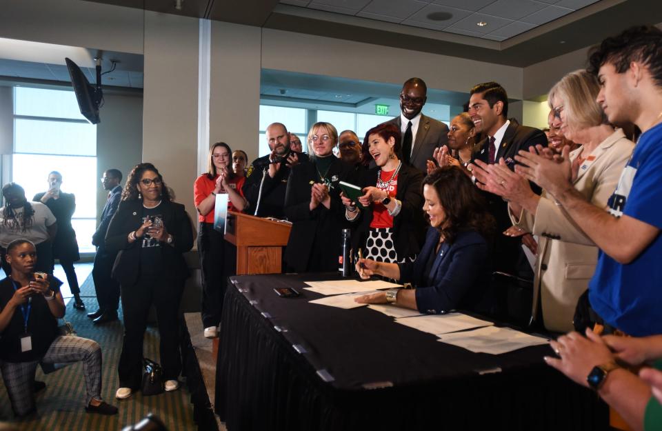 Michigan Governor Gretchen Whitmer signs a package of gun bills Thursday, April 13, 2023, at Spartan Stadium in East Lansing.