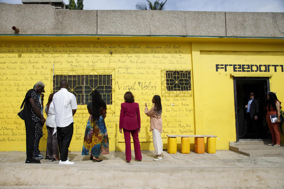 U.S. Vice President Kamala Harris, flanked by Vibration studio at the freedom skate park founder Sandy Alibo, centre right, looks at a mural in Accra, Ghana, Monday March 27, 2023. Vibration studios is a work station for young creative artists that includes a community recording studio and music business program. Harris is on a seven-day African visit that will also take her to Tanzania and Zambia. (AP Photo/Misper Apawu)