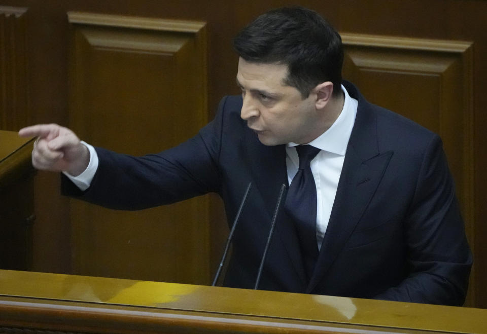 Ukrainian President Volodymyr Zelenskyy gestures as he addresses lawmakers in Kyiv, Ukraine, Wednesday, Dec.1, 2021. Ukraine marks the 30th anniversary of the referendum on independence. (AP Photo/Efrem Lukatsky)