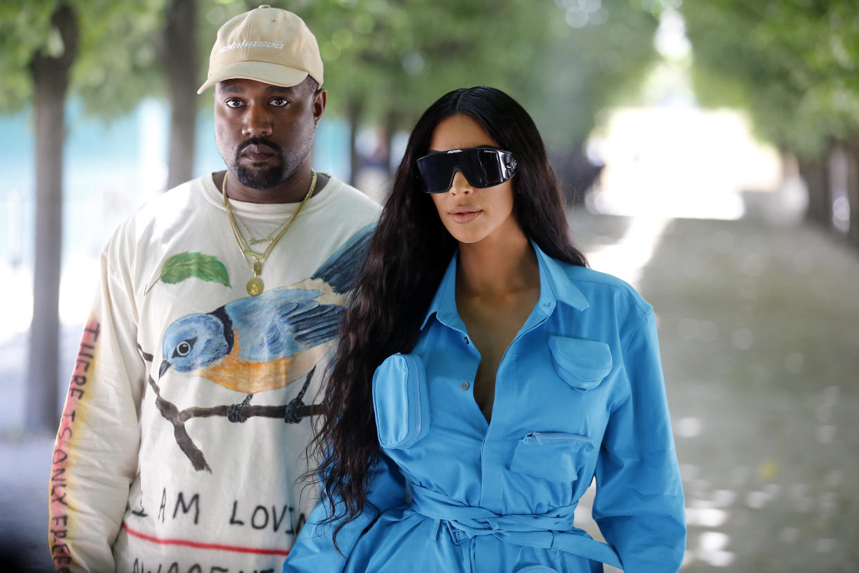 Kanye West and Kim Kardashian attend the Louis Vuitton Menswear spring-summer 2019 show during Paris Fashion Week on June 21, 2018. (Photo: Chesnot/WireImage)