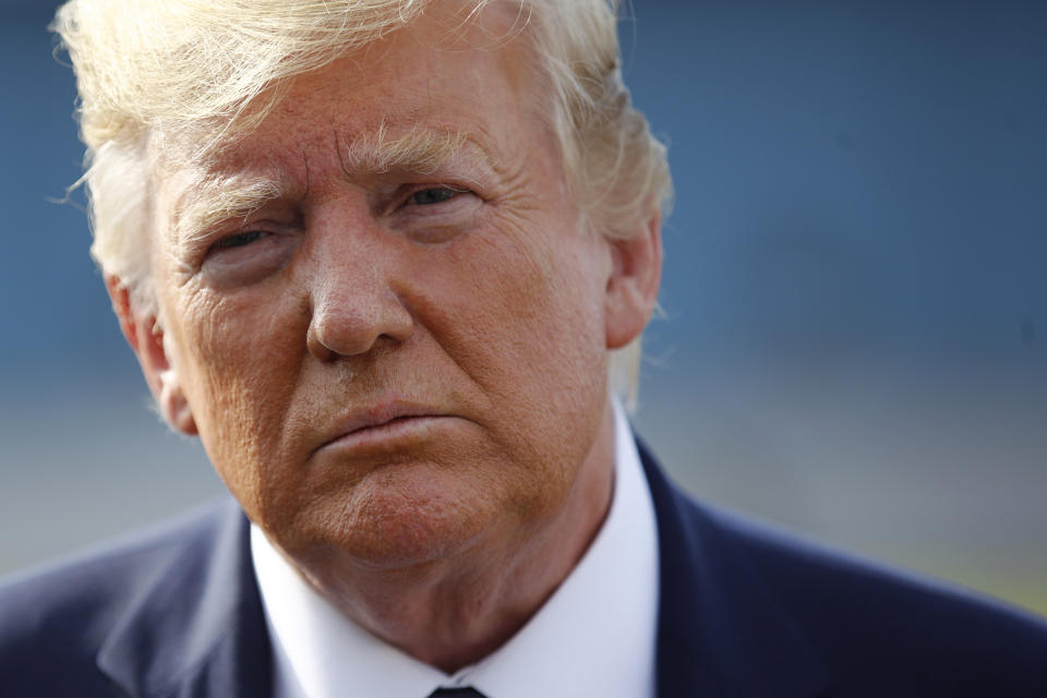 In this Aug. 18, 2019, photo, President Donald Trump speaks with reporters before boarding Air Force One at Morristown Municipal Airport in Morristown, N.J. (AP Photo/Patrick Semansky)