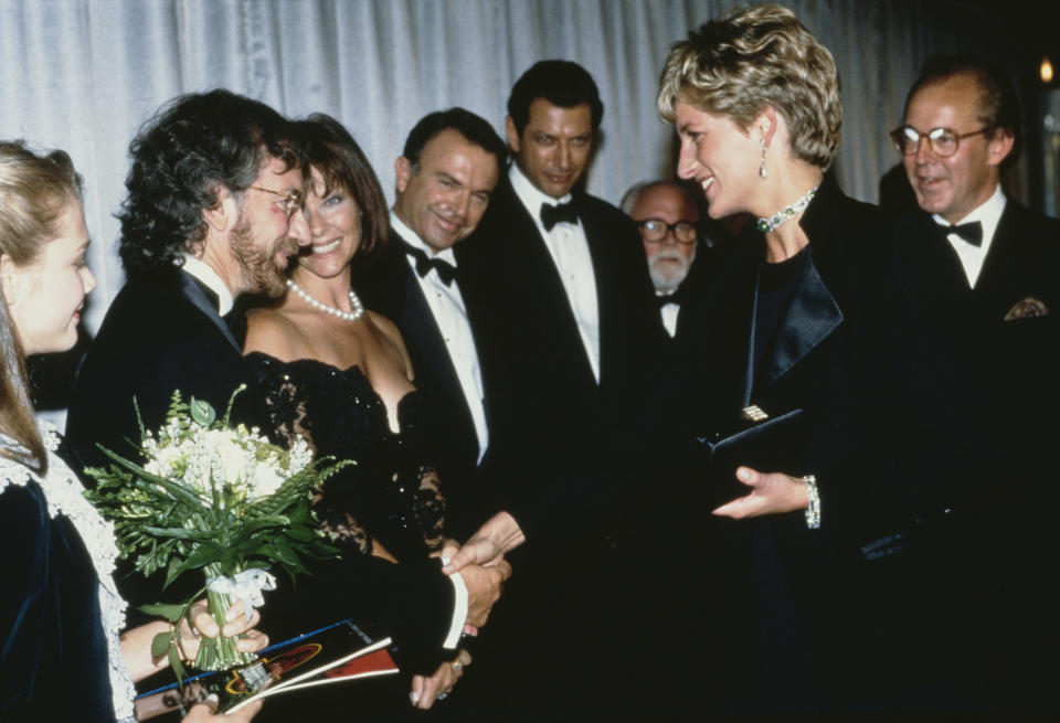 Diana, Princess of Wales (1961 - 1997) attends the premiere of the Steven Spielberg film 'Jurassic Park' in London, 15th July 1993. From left to right, she is meeting star Ariana Richards, director Spielberg and his wife Kate Capshaw, and stars Sam Neill, Jeff Goldblum and Richard Attenborough. (Photo by Princess Diana Archive/Getty Images)