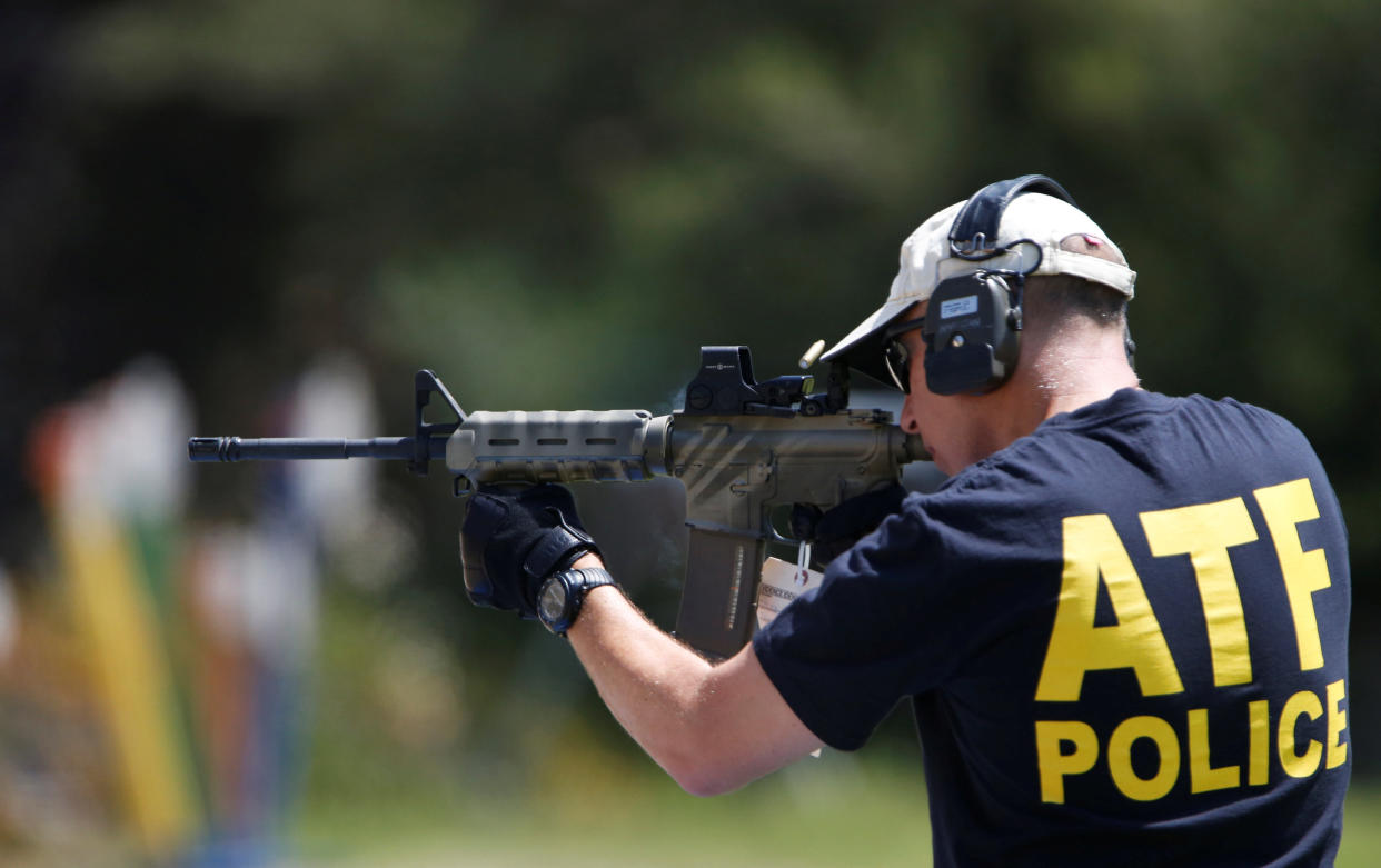 An officer of the Bureau of Alcohol, Tobacco, Firearms and Explosives fires a&nbsp;weapon used in several crimes to collect casings to be archived in the National Integrated Ballistic Information Network. (Photo: Mario Anzuoni / Reuters)