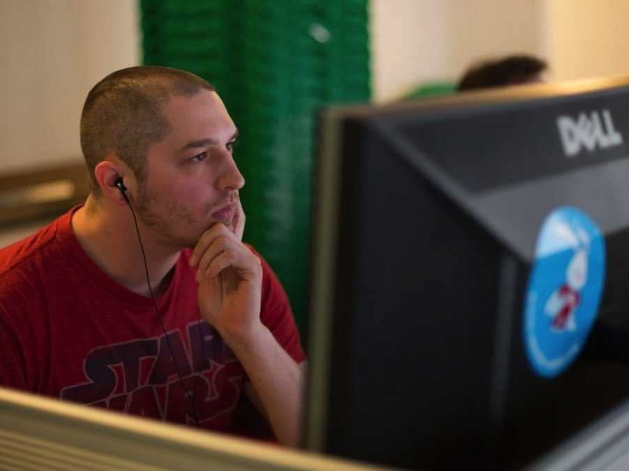 devops engineer zack kisling looks totally immersed with his headphones on