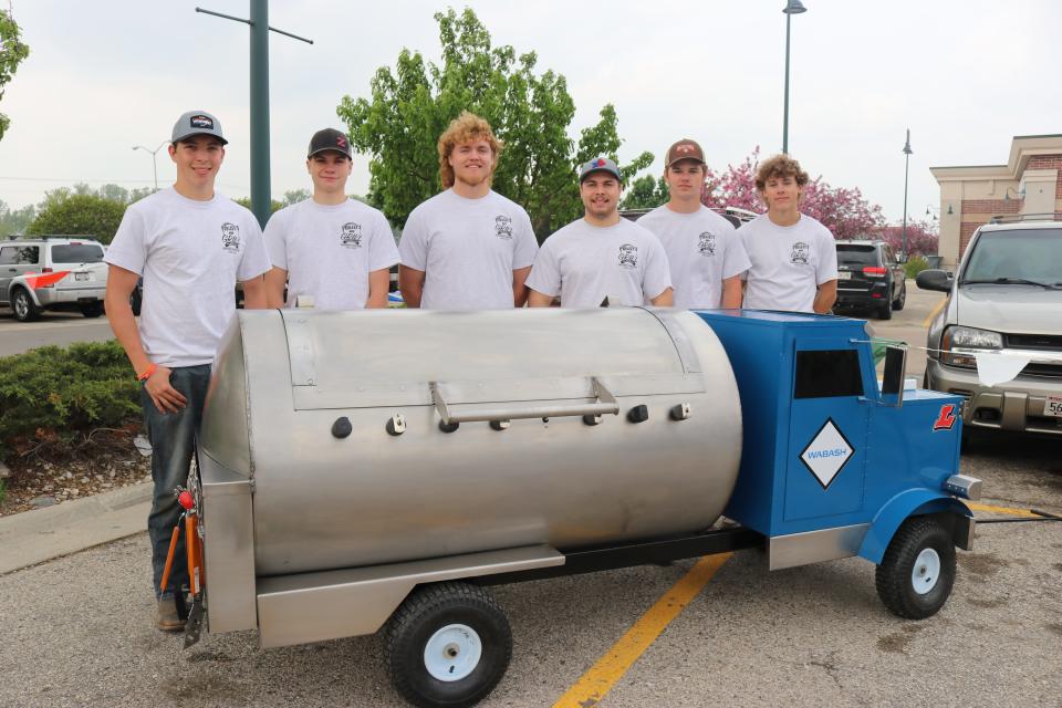 Project G.R.I.L.L 2023 participants represented area high schools as they unveil grills they made while learning about local manufacturing businesses and how to take a project from idea to completion.