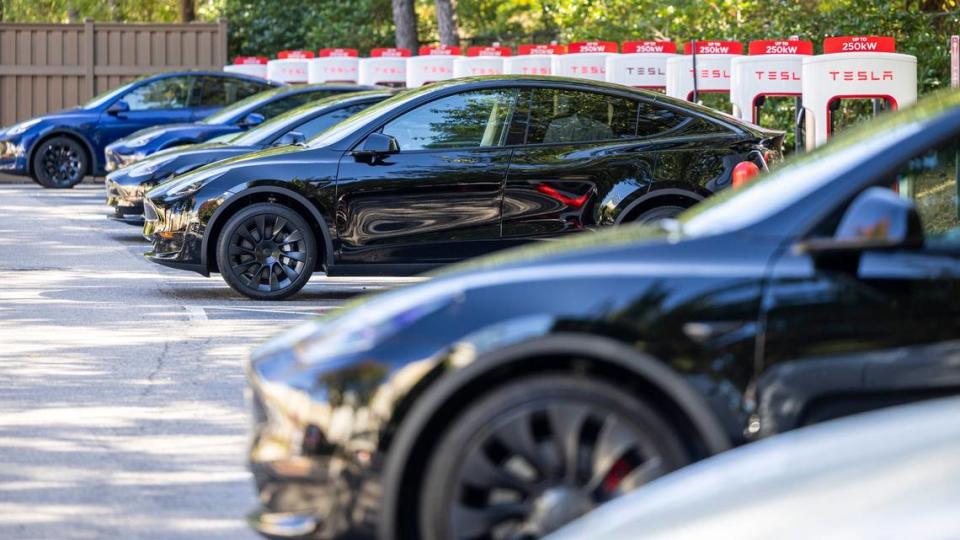 Teslas charge at an electric charging station at North Hills in Raleigh Tuesday, October. 17, 2023. Electric vehicle owners will see an increase in both new vehicle and annual registration fees.