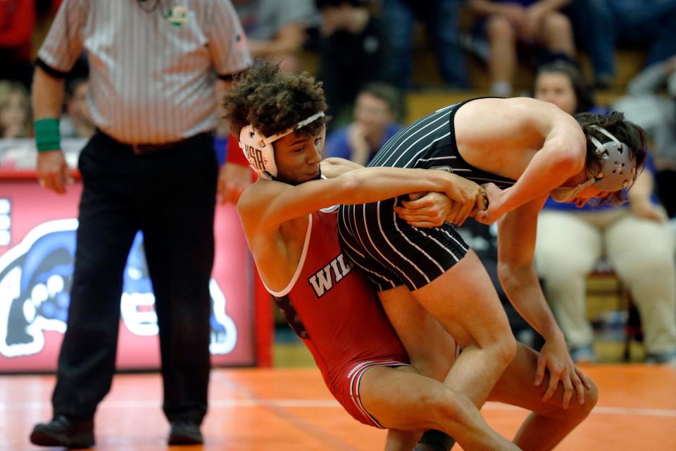 Newark's Jibreel Smith wrestles Carrollton's Levi Pidgeon during the finals at 126 pounds during the Licking Valley Invitational on Saturday, Jan. 7, 2023, in Hanover, Ohio.