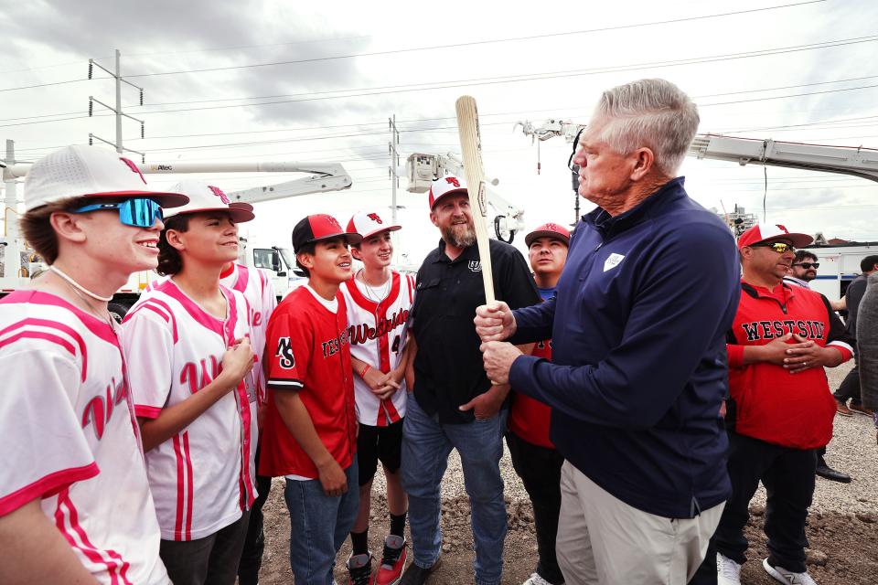 Dale Murphy talks to young baseball players at the groundbreaking of the Power District property in Salt Lake City.