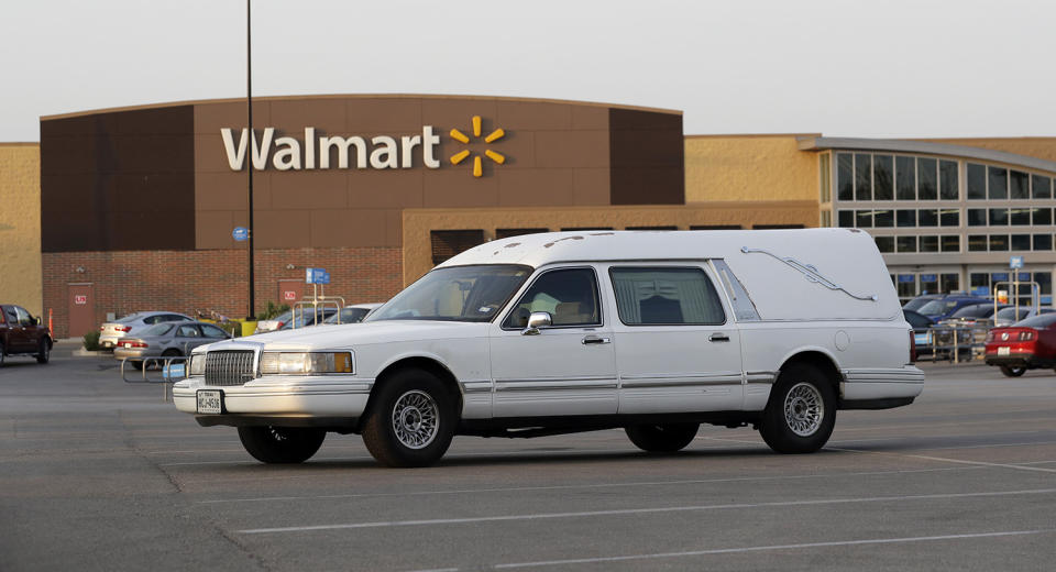 <p>A hearse sits in the parking lot of a Walmart store where eight people were found dead in a tractor-trailer loaded with at least 30 others outside in stifling summer heat in what police are calling a horrific human trafficking case, Sunday, July 23, 2017, in San Antonio. (AP Photo/Eric Gay) </p>