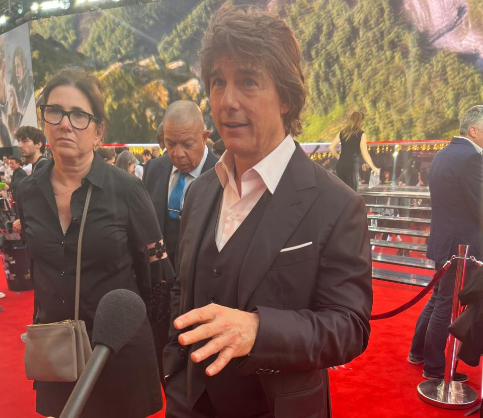 Tom Cruise speaking to press on the "Mission: Impossible - Dead Reckoning" red carpet.