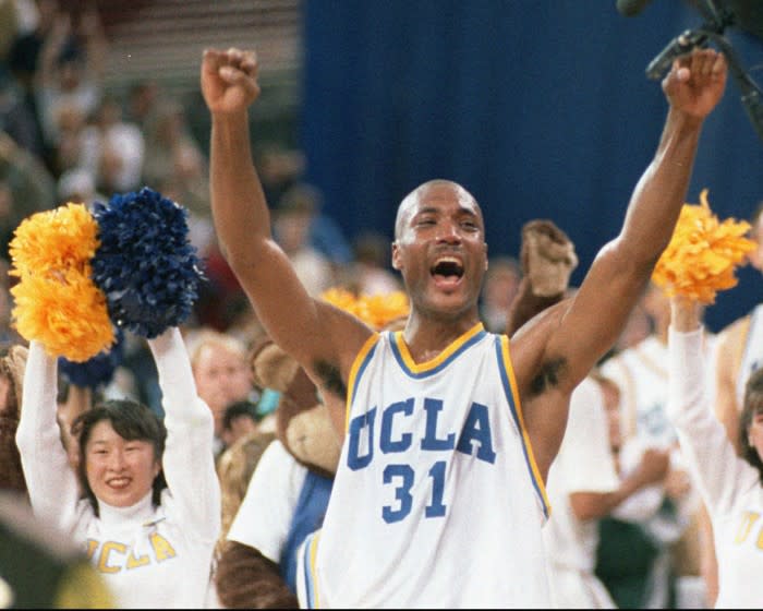 FILE - In this April 3, 1995 photo, UCLA's Ed O'Bannon celebrates after his team won the championship NCAA game.
