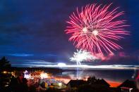 <p>Fireworks in Arromanches-les-Bains seen from the M4A2 Sherman Tank Monument during D-Day Festival Normandy 2017. (Photo: Artur Widak/NurPhoto via Getty Images) </p>