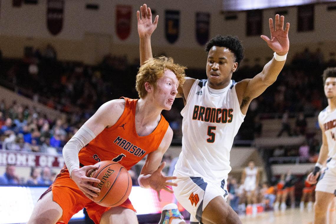 Madison Southern’s Jay Rose drives down the baseline against Frederick Douglass guard Tylon Webb.