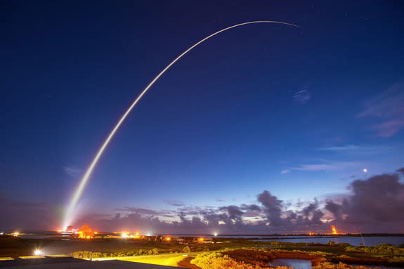 An Atlas V rocket carrying the MUOS-4 satellite took off from Florida's Cape Canaveral Air Force Station at 6:18 a.m. EDT (1018 GMT). This long exposure snapshot captured the streak of the rocket's fiery tail across the predawn sky. Credit: Uni
